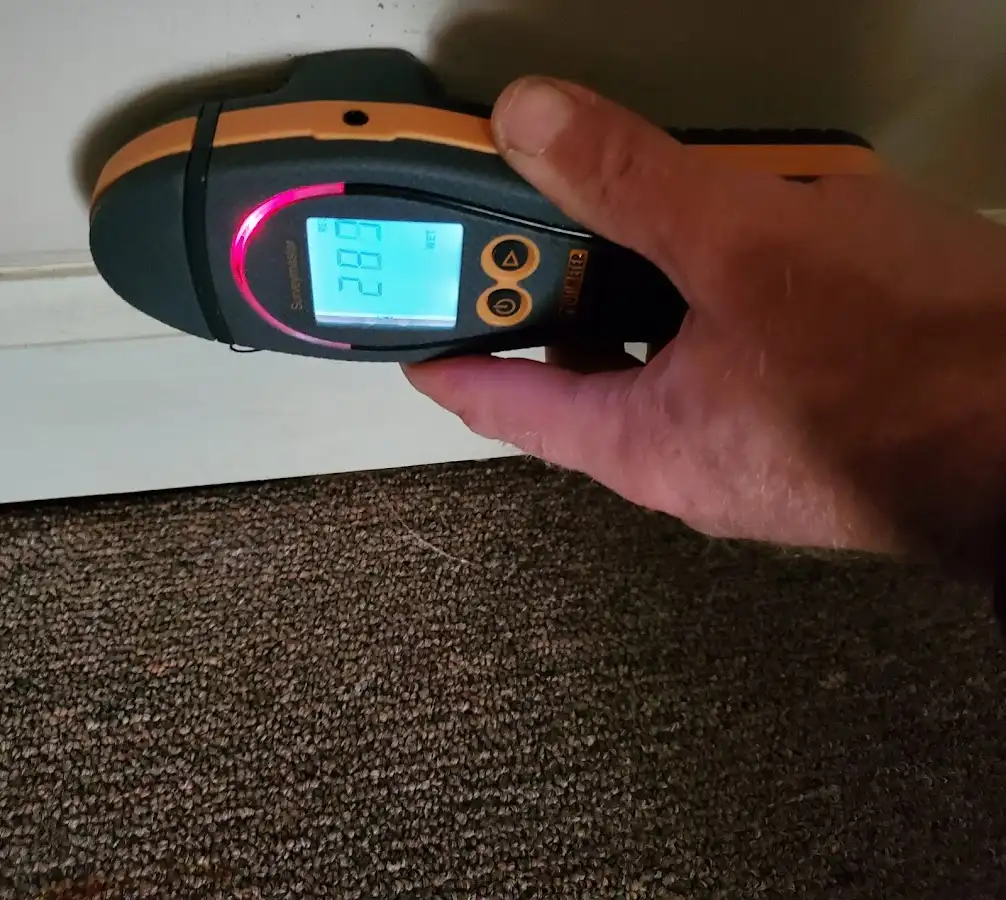 Moisture detection at baseboard during Storm Damage Restoration in Downingtown